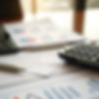 A calculator and financial documents on a desk representing loan calculations