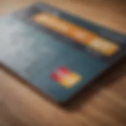 A close-up of a cash back credit card on a wooden table