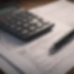 A close-up view of tax documents with a calculator and pen.