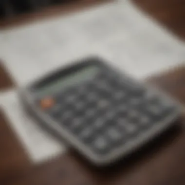 Close-up of a financial calculator with mortgage documents