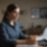 A student reviewing financial documents with a laptop