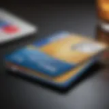 A close-up of a credit card on a modern desk setup.