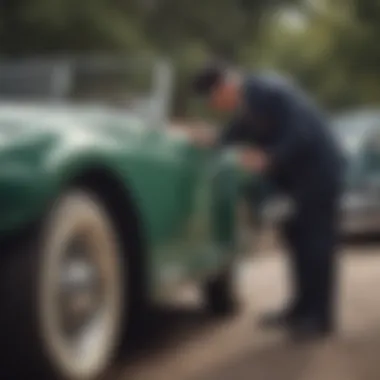 A vintage car enthusiast inspecting a classic vehicle in detail