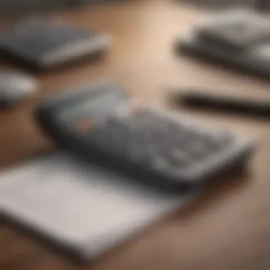 A close-up of a mortgage calculator displayed on a wooden desk with a notepad and pen.